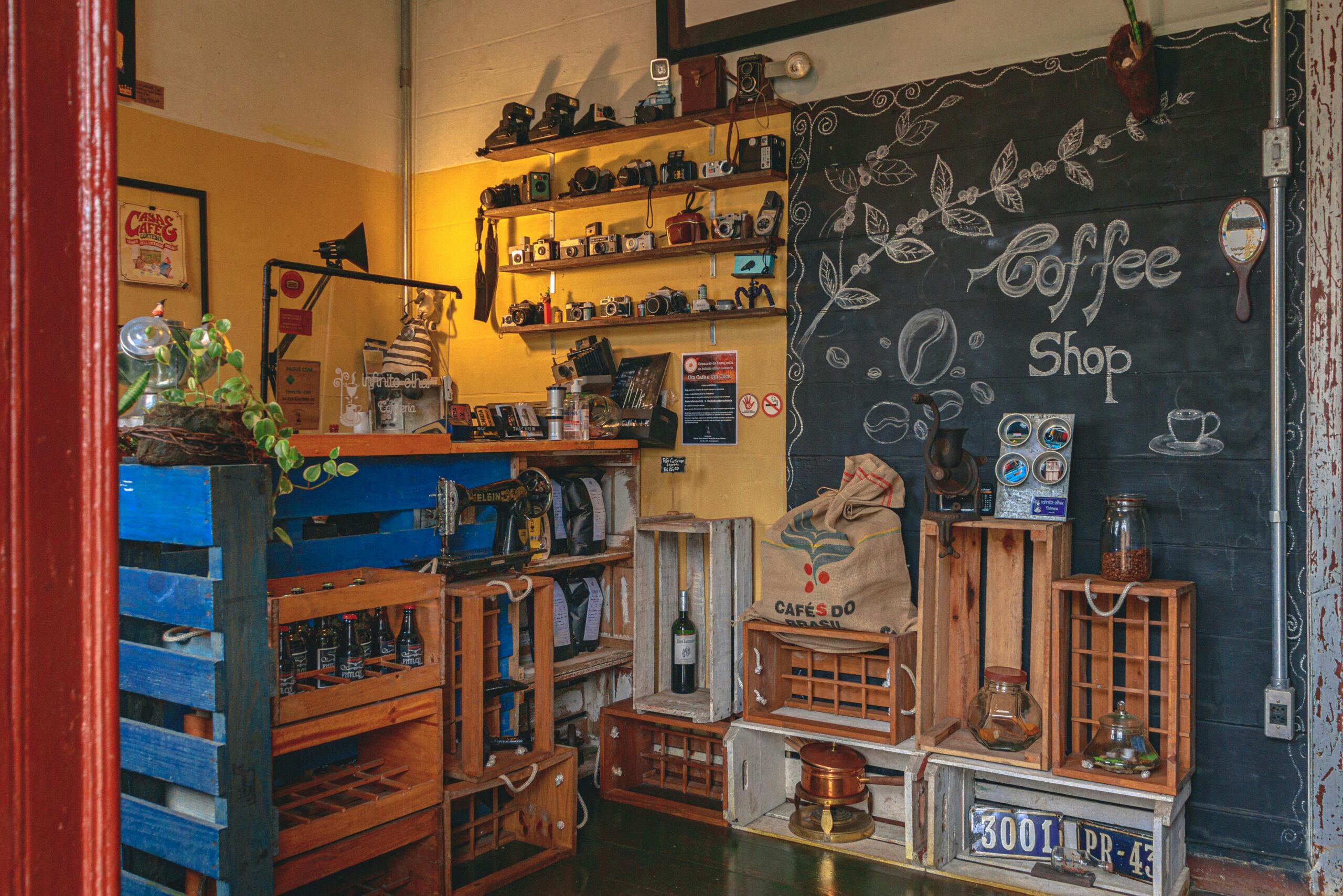 A beautiful pink lily bouquet in a vase on a table in a bright, modern room with large windows.