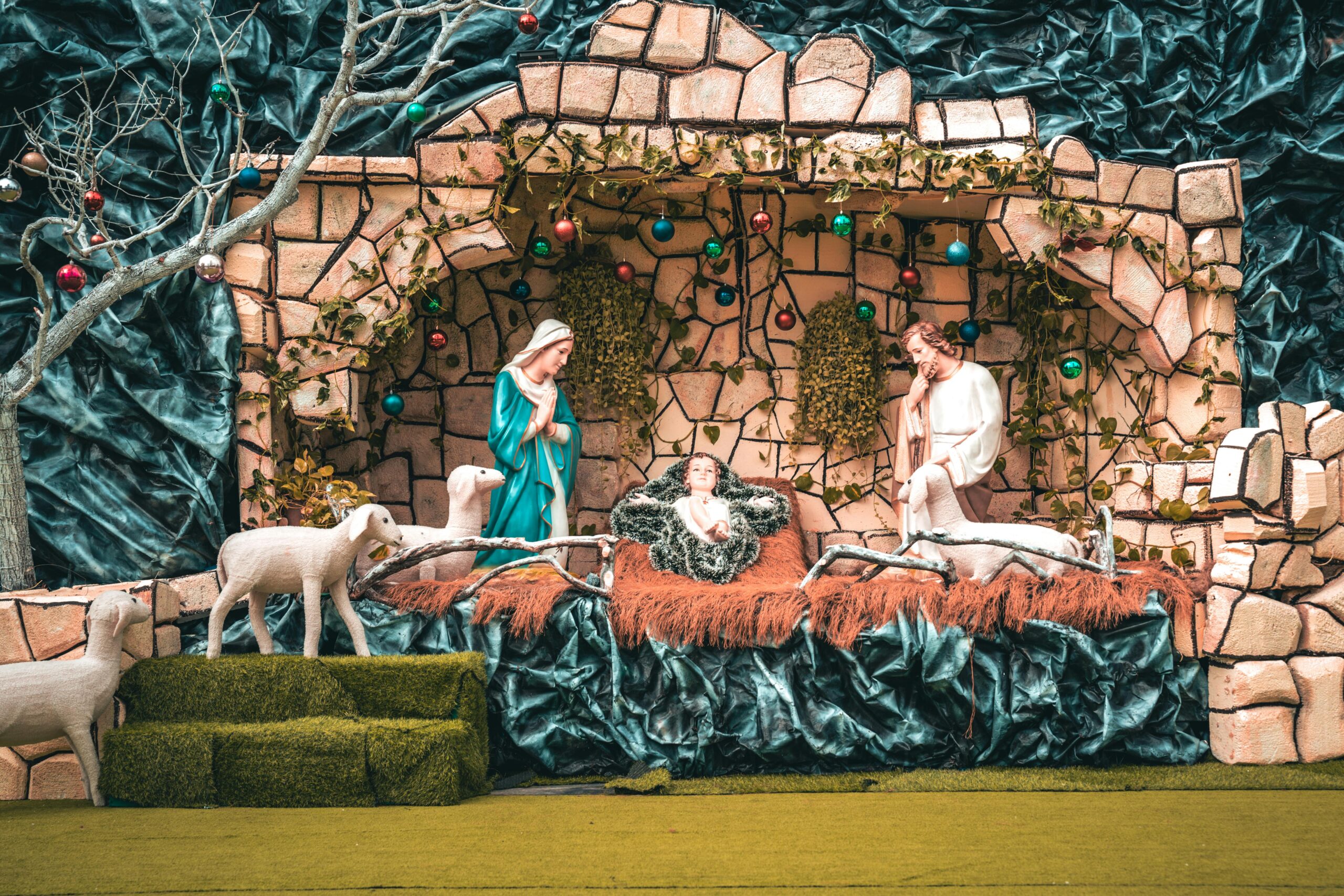 Beautifully crafted nativity scene depicting the birth of Jesus with Mary, Joseph, and shepherds.