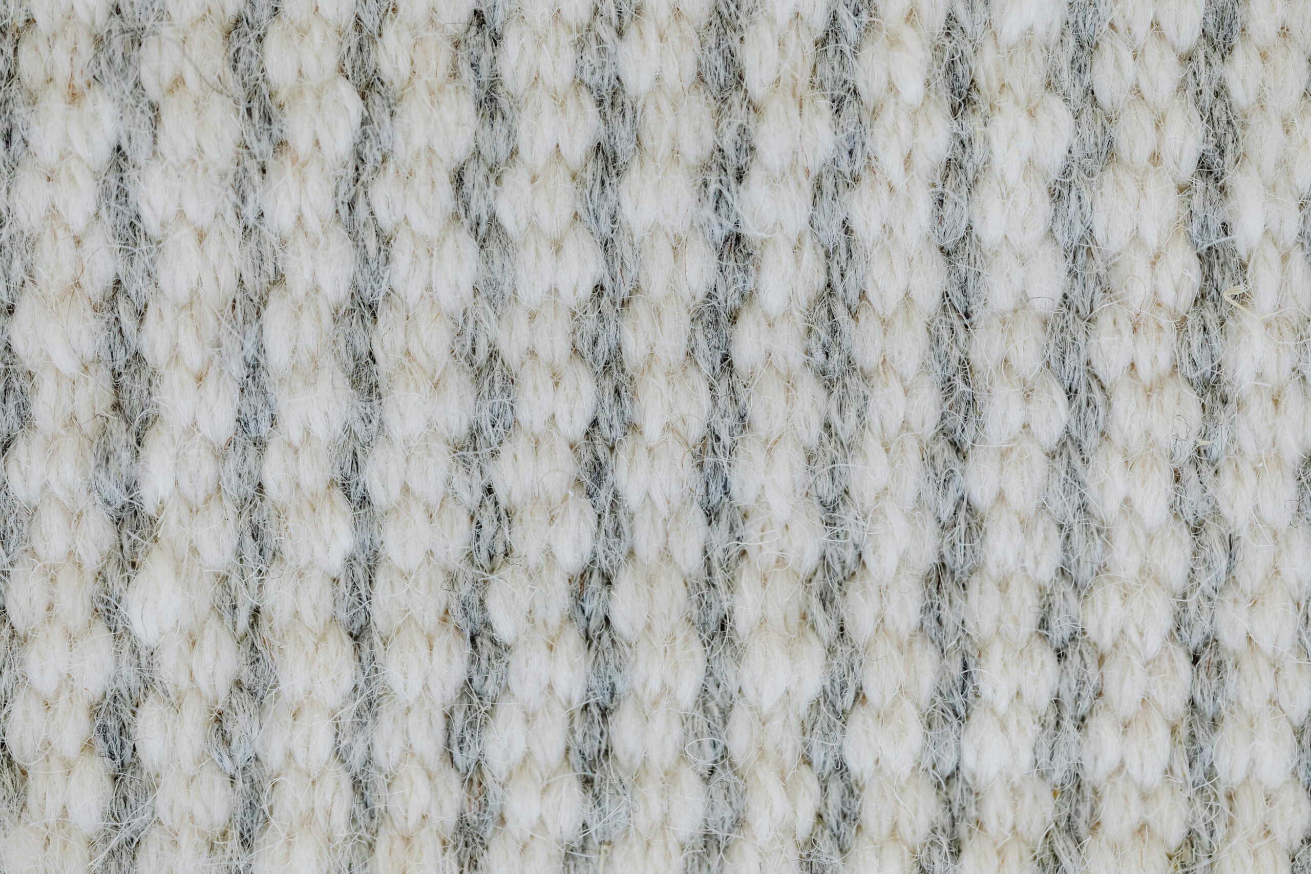 Contemporary room interior with couch and TV with black screen against tables under shiny chandelier in house