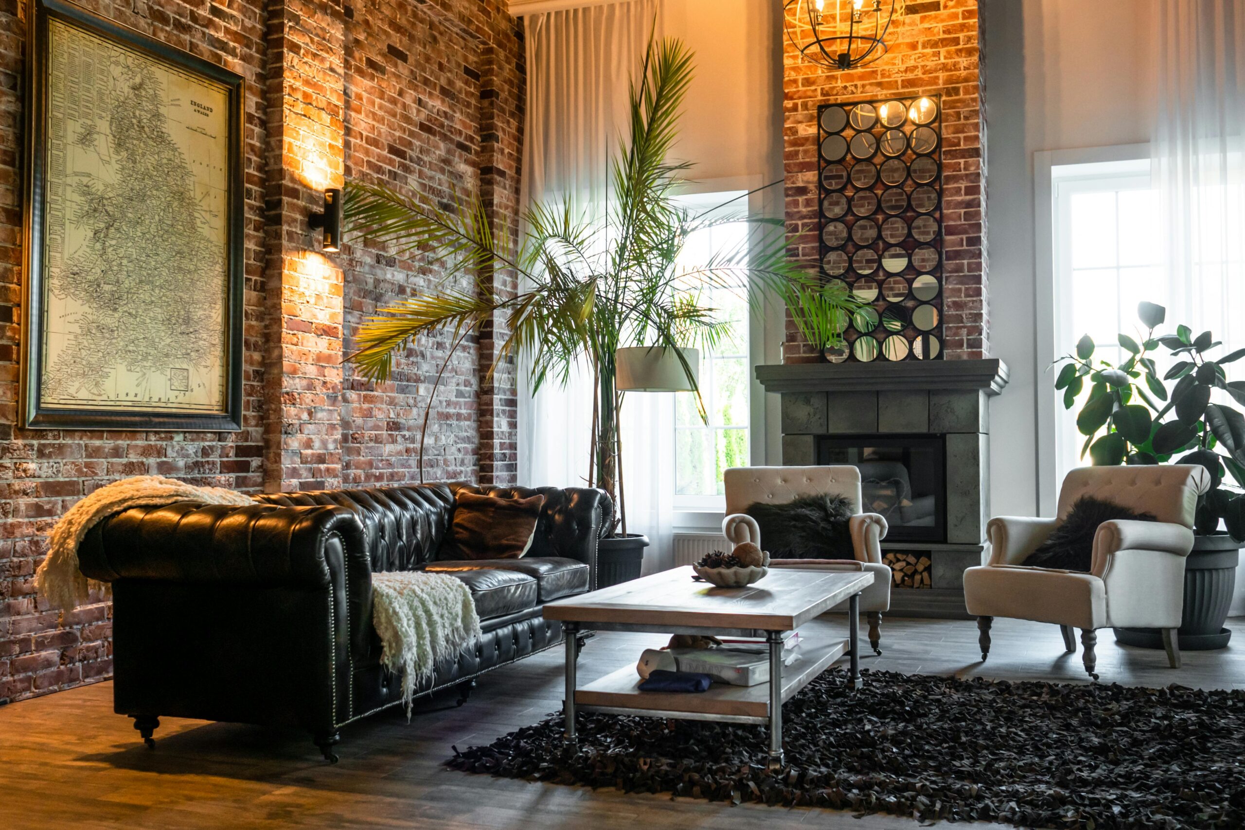 Cozy living room with industrial design featuring brick walls, classic furniture and chic decor.