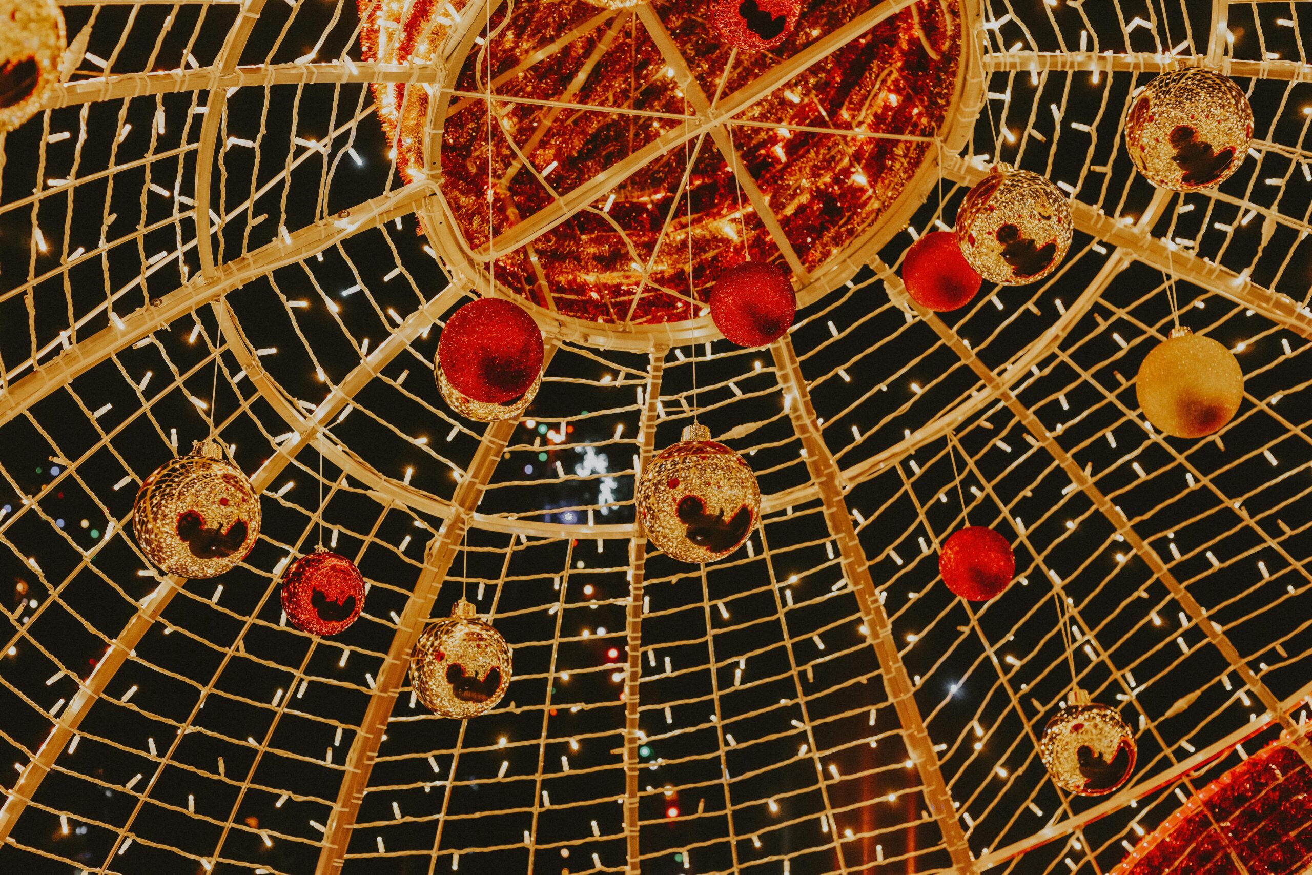 Vibrant Christmas baubles and enchanting lights create a festive atmosphere.